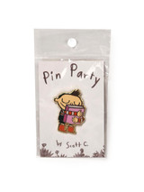 Hug Machine hugging a book enamel pin in package