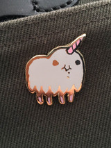 Unicorn enamel pin on a thing